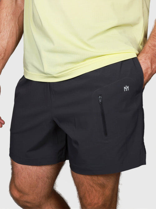 Black Apex Pro Compression Short by MUEV with zippered pocket designed for padel and pickleball apparel