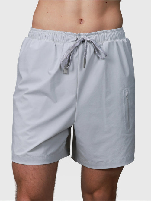 Gray Apex Pro Compression Short by MUEV with elastic waistband and zippered pocket for padel and pickleball clothing