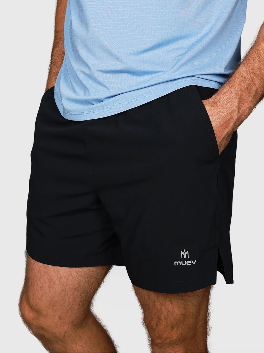 side close-up of man wearing Black Base Line Short by MUEV designed for padel and pickleball apparel