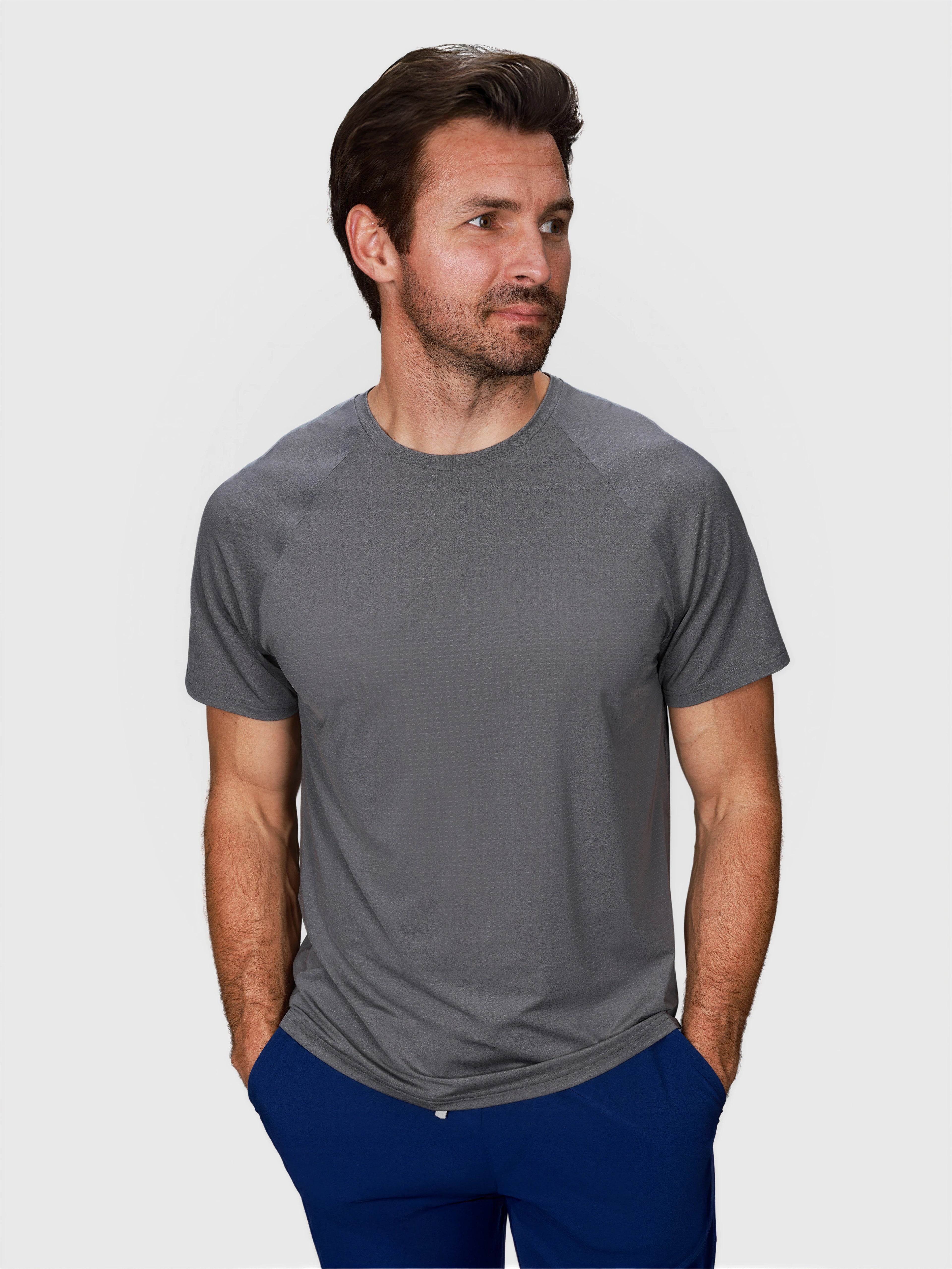 man wearing pewter gray Dink Performance Tee by MUEV designed for padel and pickleball apparel with short sleeves