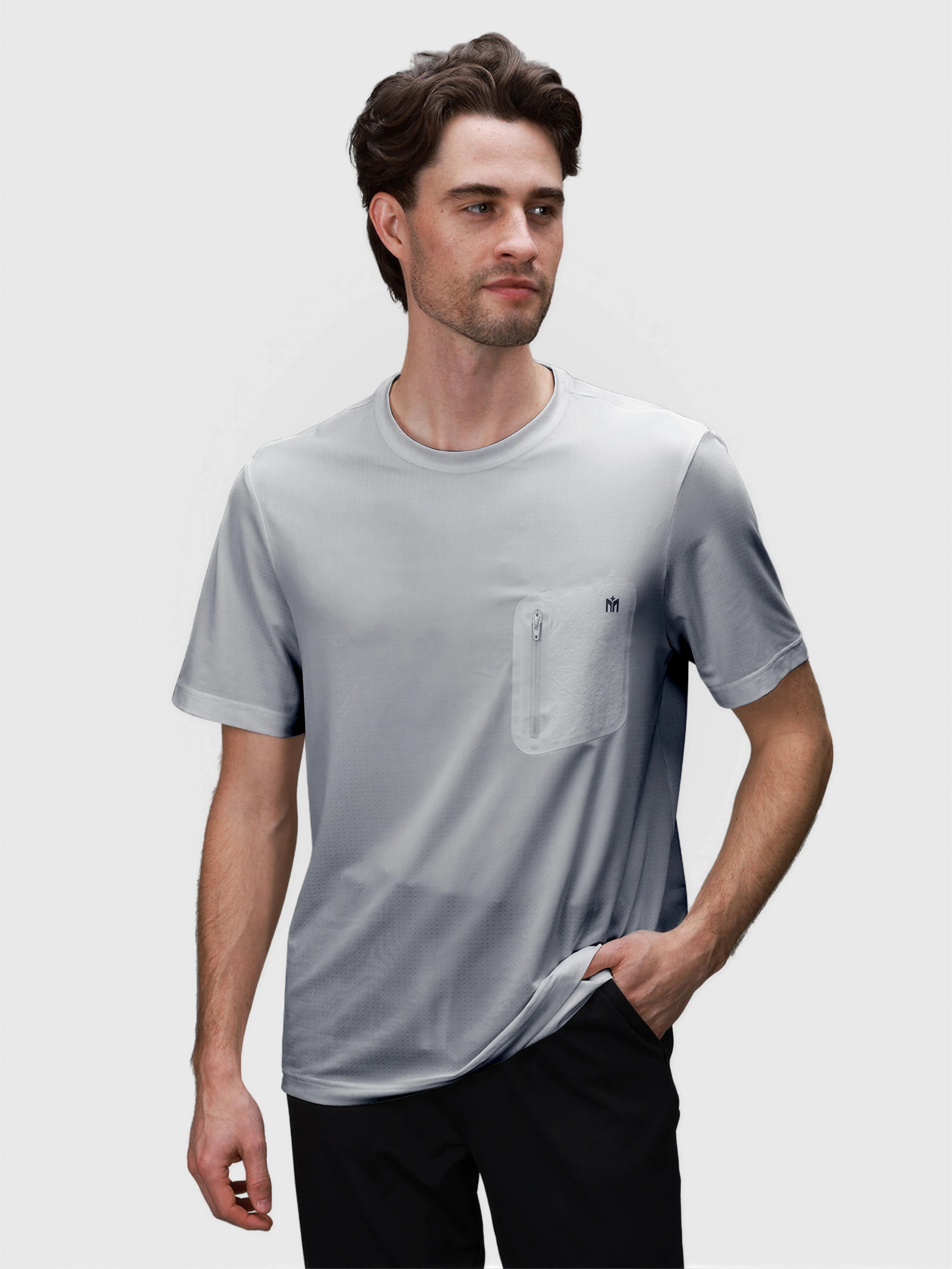 Man wearing gray Flex Bonded Pocket Tee by MUEV designed for breathable pickleball and padel clothing comfort