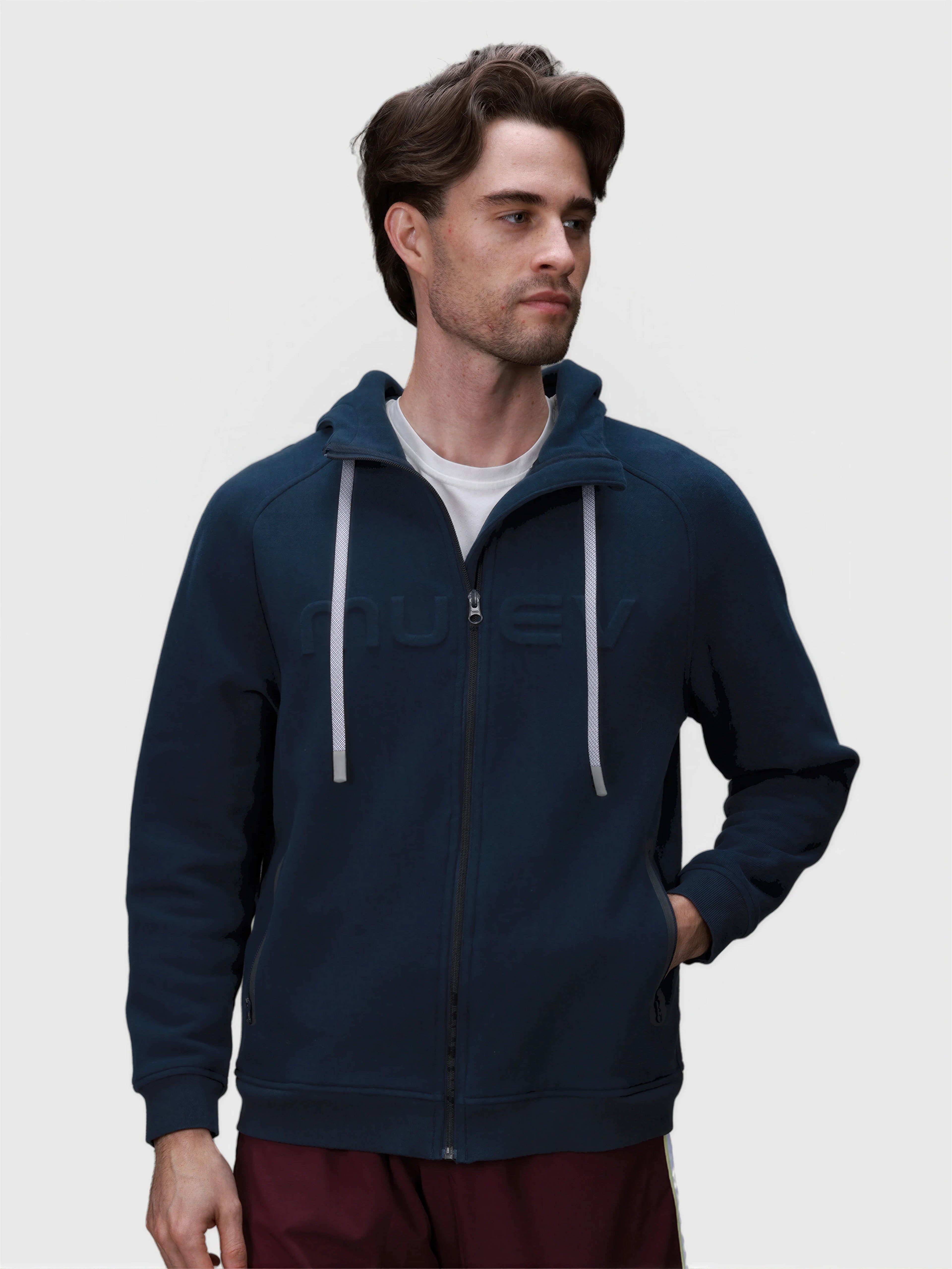 Man wearing heather navy Men's Off Court Full Zip Hoodie by MUEV for padel and pickleball apparel