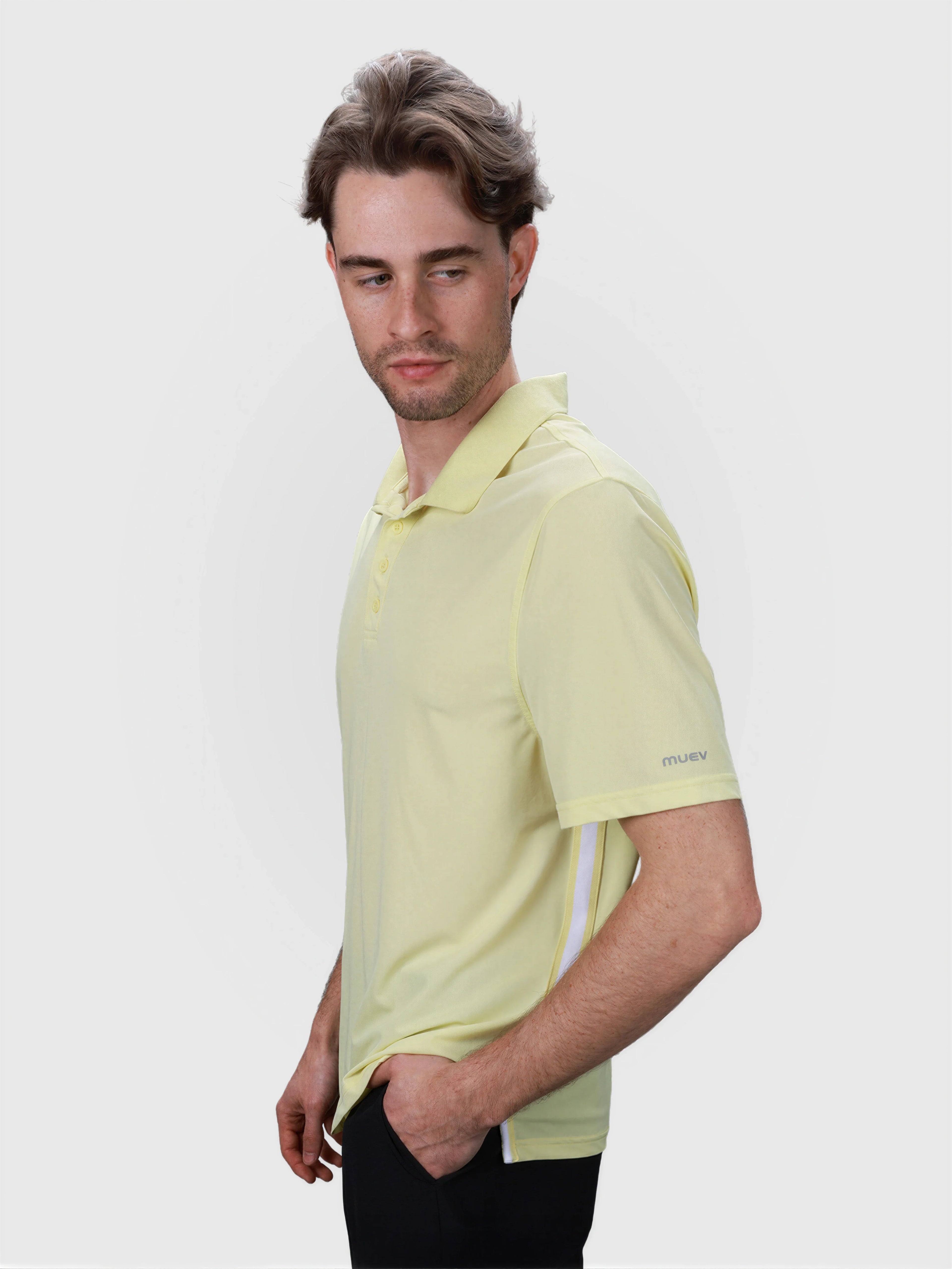 Man modeling citron Tip Polo by MUEV designed for padel and pickleball apparel with button collar detail